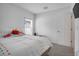 Charming bedroom with a white bedspread and colorful accents at 1352 Sunset Preserve Way, Port Charlotte, FL 33953