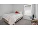 Cozy bedroom with twin beds and colorful bedding at 1352 Sunset Preserve Way, Port Charlotte, FL 33953