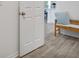 Convenient laundry room with washer, dryer, and bench at 1352 Sunset Preserve Way, Port Charlotte, FL 33953