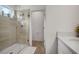 Bathroom with a large walk-in shower and gray tile at 1352 Sunset Preserve Way, Port Charlotte, FL 33953