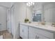 Double vanity bathroom with white cabinets and quartz countertops at 1352 Sunset Preserve Way, Port Charlotte, FL 33953