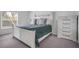 Bedroom with a white bed frame, gray bedding and a dresser at 1352 Sunset Preserve Way, Port Charlotte, FL 33953