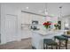 Spacious kitchen with white cabinets, stainless steel appliances, and an island at 1352 Sunset Preserve Way, Port Charlotte, FL 33953