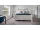 Spacious bedroom with a white bed frame and gray bedding, plus a dresser at 1352 Sunset Preserve Way, Port Charlotte, FL 33953
