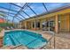 Relaxing kidney-shaped pool with a waterfall feature at 3533 Pennyroyal Rd, Port Charlotte, FL 33953