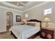 Spacious main bedroom with king-size bed and ensuite bathroom at 3533 Pennyroyal Rd, Port Charlotte, FL 33953