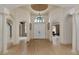 Bright and airy foyer with hardwood floors and arched doorways at 3533 Pennyroyal Rd, Port Charlotte, FL 33953