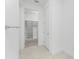 Large walk-in closet with ample shelving at 9982 Beachwalk Dr, Englewood, FL 34223