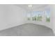 Bright bedroom with bay window and ceiling fan at 9982 Beachwalk Dr, Englewood, FL 34223