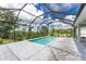 Spacious screened pool and patio with modern design at 9982 Beachwalk Dr, Englewood, FL 34223