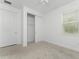 Spacious bedroom with closet and window at 9982 Beachwalk Dr, Englewood, FL 34223