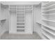 Spacious walk-in closet with built-in shelves at 9982 Beachwalk Dr, Englewood, FL 34223