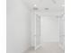 Open office space featuring French doors and tiled floor at 9982 Beachwalk Dr, Englewood, FL 34223