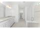 Modern bathroom with double vanity and shower at 9982 Beachwalk Dr, Englewood, FL 34223