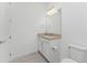 Small bathroom with vanity and toilet at 9982 Beachwalk Dr, Englewood, FL 34223