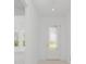 Bright and airy entryway with a white door and tiled floor at 9982 Beachwalk Dr, Englewood, FL 34223