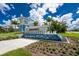 Beachwalk community entrance with fountain and landscaping at 9982 Beachwalk Dr, Englewood, FL 34223