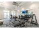 Well-equipped fitness center with weight machines, cardio equipment, and plenty of space at 9982 Beachwalk Dr, Englewood, FL 34223
