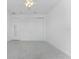 Bright bedroom with ceiling fan and double door closet at 9982 Beachwalk Dr, Englewood, FL 34223