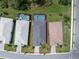 Aerial view of a house with a pool and landscaped yard in a residential community at 9982 Beachwalk Dr, Englewood, FL 34223