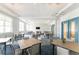 Modern meeting room with multiple tables and chairs at 9982 Beachwalk Dr, Englewood, FL 34223