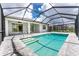 Enclosed pool and patio area with modern design at 9982 Beachwalk Dr, Englewood, FL 34223