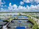 Beachwalk tennis courts with shade structures at 9982 Beachwalk Dr, Englewood, FL 34223
