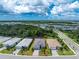Aerial view of a single Gathering home in a residential neighborhood at 9982 Beachwalk Dr, Englewood, FL 34223