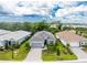 Aerial view of single-Gathering home in a community with similar homes at 9982 Beachwalk Dr, Englewood, FL 34223
