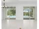 Bright dining room with pool view and chandelier at 9982 Beachwalk Dr, Englewood, FL 34223