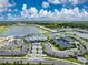 Aerial view of Beachwalk amenities including pool, tennis, and clubhouse at 9982 Beachwalk Dr, Englewood, FL 34223
