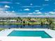 Relaxing community pool overlooking a tranquil canal at 66 Boundary Blvd # 238, Rotonda West, FL 33947