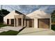 Modern home exterior with two-car garage at 14074 Whittier Ln, Port Charlotte, FL 33981