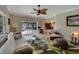 Spacious living room with pool view, comfy seating and large windows at 229 Rotonda E Blvd, Rotonda West, FL 33947