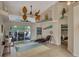 Relaxing living room with wicker furniture and a view of the pool at 229 Rotonda E Blvd, Rotonda West, FL 33947