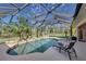 Inviting kidney shaped pool with screened enclosure at 229 Rotonda E Blvd, Rotonda West, FL 33947