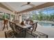 Relaxing pool area with covered patio and outdoor dining at 229 Rotonda E Blvd, Rotonda West, FL 33947