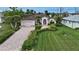 Single-Gathering home with a brick driveway and lush lawn at 229 Rotonda E Blvd, Rotonda West, FL 33947