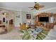 Comfortable living room with wicker furniture and a large TV at 229 Rotonda E Blvd, Rotonda West, FL 33947