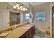 Bathroom with granite countertop and walk-in shower at 229 Rotonda E Blvd, Rotonda West, FL 33947