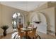 Bright dining room with a glass-top table and wicker chairs at 229 Rotonda E Blvd, Rotonda West, FL 33947