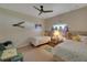 Bedroom with twin beds, ceiling fan and whimsical decor at 229 Rotonda E Blvd, Rotonda West, FL 33947