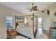 Peaceful bedroom with a canopy bed and plenty of natural light at 229 Rotonda E Blvd, Rotonda West, FL 33947