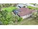 Aerial view of house with pool and lush green surroundings at 229 Rotonda E Blvd, Rotonda West, FL 33947