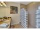 Bathroom with a walk-in shower and granite countertop at 229 Rotonda E Blvd, Rotonda West, FL 33947