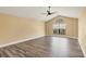 Large main bedroom with vaulted ceiling, wood-look flooring, and window seat at 15595 Staunton Cir, Port Charlotte, FL 33981