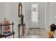 Bright and airy entryway with tile floors, a console table, and a decorative mirror at 14589 Ponce De Leon Trl, Port Charlotte, FL 33981