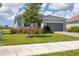 Single-story house with gray siding and a two-car garage at 14589 Ponce De Leon Trl, Port Charlotte, FL 33981