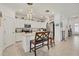 Modern kitchen with white cabinets, granite countertops, and island at 14589 Ponce De Leon Trl, Port Charlotte, FL 33981