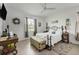 Bright bedroom with a queen-size bed, window, and tiled floor at 14589 Ponce De Leon Trl, Port Charlotte, FL 33981